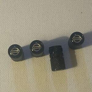 Nissan Logo Valve Stem caps in Black set of 4 NWT